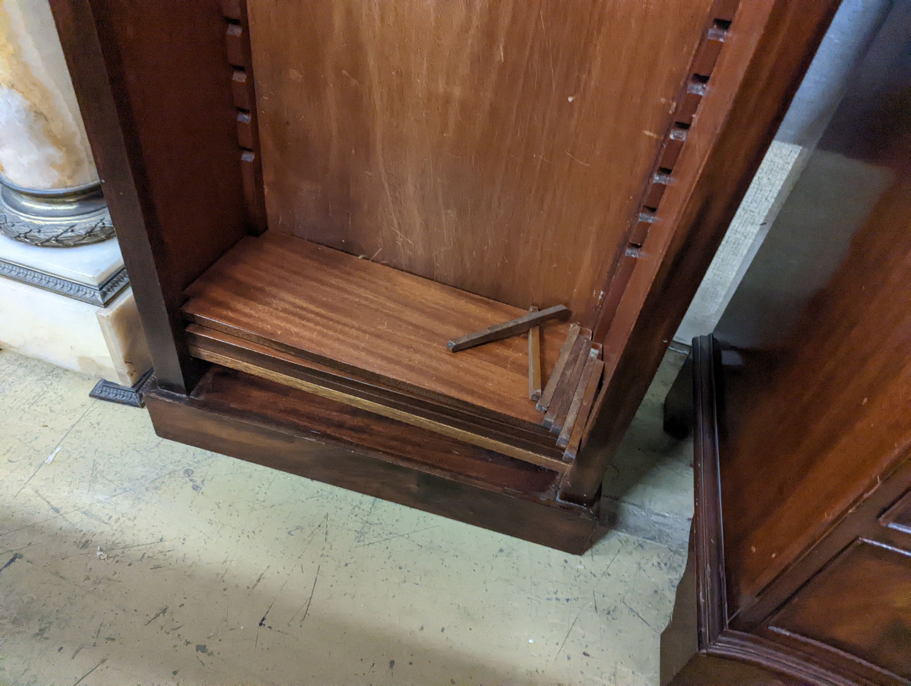 A George II style narrow walnut open bookcase, width 65cm, depth 30cm, height 184cm